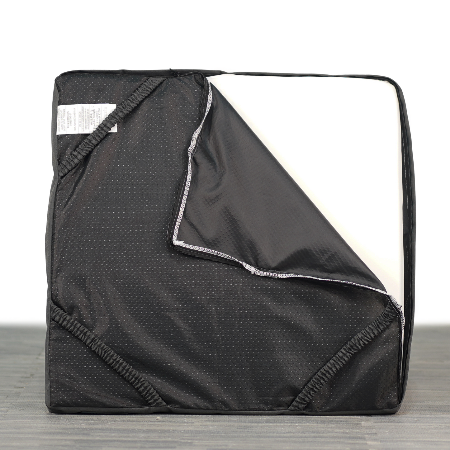 Bottom side of Restore Dog bed with a corner unzipped. The memory foam is visible.